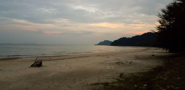 Scenic view of beach against sky during sunset