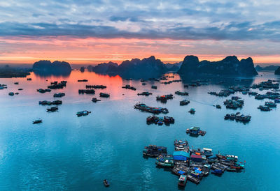 High angle view of boat moored on sea against sky