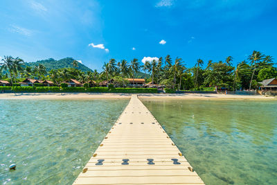 Pier over sea against sky
