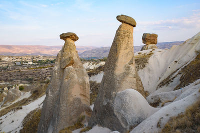 Panoramic view of rock formations against sky