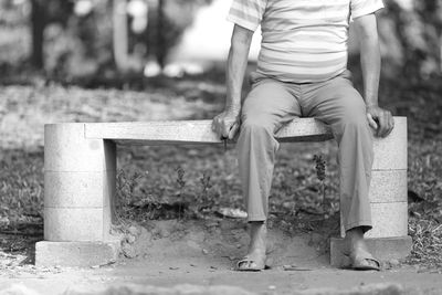 Boy sitting in park