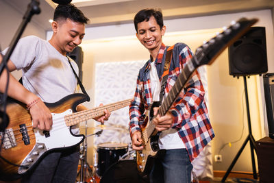 Friends playing guitar