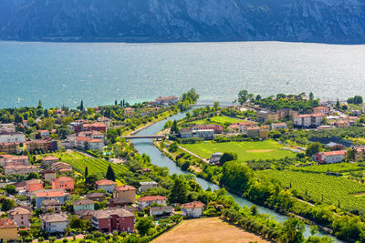 High angle view of townscape by sea