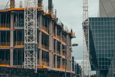 Low angle view of buildings against sky in city