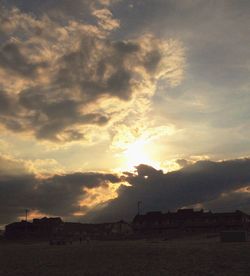 Scenic view of landscape against cloudy sky