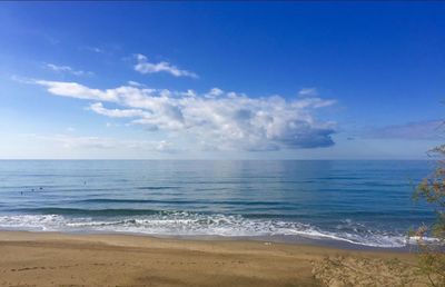 Scenic view of sea against blue sky