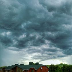 Low angle view of building against cloudy sky