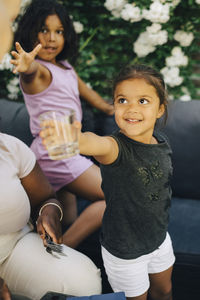 Girl with drinking glass at garden party