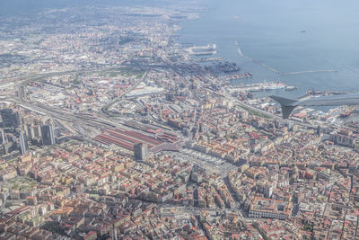 Aerial view of city by sea