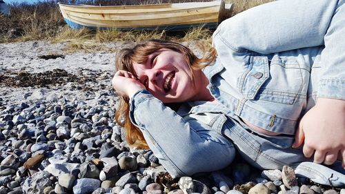 Happy woman relaxing at beach