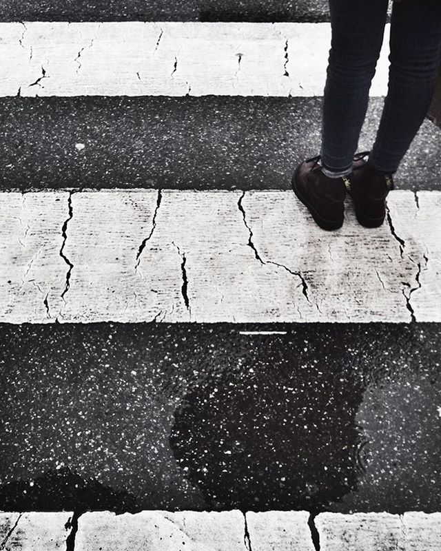 low section, street, lifestyles, person, men, walking, unrecognizable person, leisure activity, standing, high angle view, road, sidewalk, outdoors, road marking, day, human foot