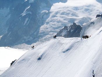 High angle view of people on snow covered mountain