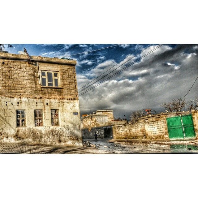 architecture, building exterior, built structure, transfer print, auto post production filter, sky, building, residential building, residential structure, window, city, house, day, street, outdoors, residential district, no people, cloud - sky, wall - building feature, exterior