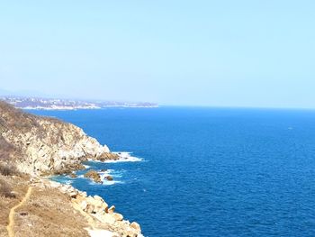 Scenic view of sea against clear sky