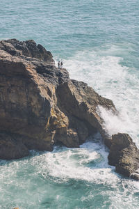 High angle view of cliff amidst sea