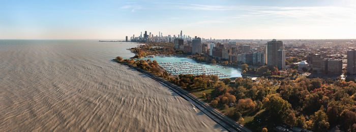 Aerial panorama above lake michigan overlooking belmont harbor and chicago skyline