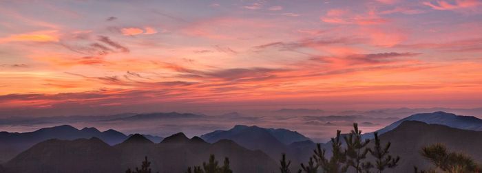 Scenic view of mountains against sky during sunset