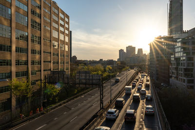 Brooklyn queen expressway with traffic on one side. buildings surrounding highway