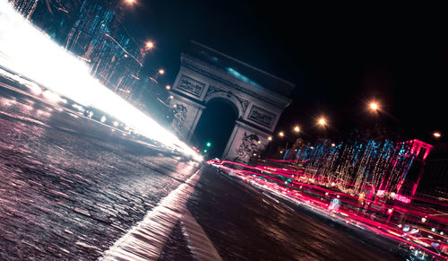 Low angle view of light trails at night
