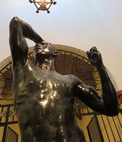 Low angle view of statue against sky