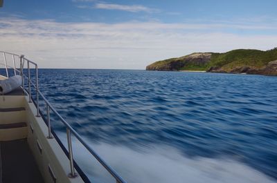 Boat sailing in sea against sky