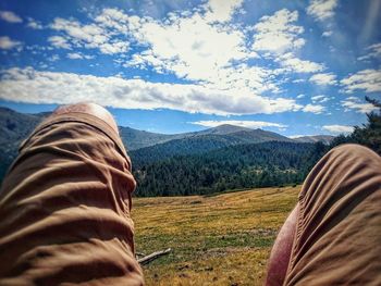 Scenic view of landscape against cloudy sky