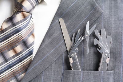 Close-up of work tools in suit pocket