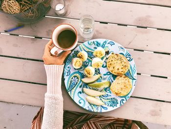 High angle view of coffee cup on table