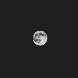 Low angle view of moon against sky at night