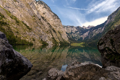 Scenic view of lake and mountains against sky