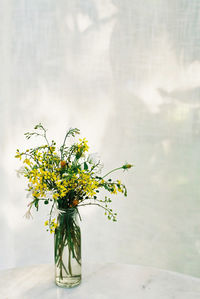 Close-up of flower vase on table