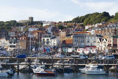 Looking across scarborough harbour with st mary's church rising above the old town