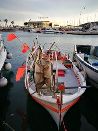 Boats moored in sea against sky