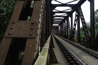 Railroad tracks by bridge