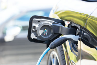 Charging battery of an electric car at charge station