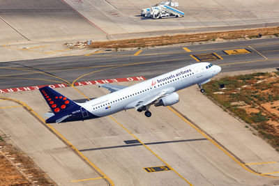 High angle view of airplane on airport runway