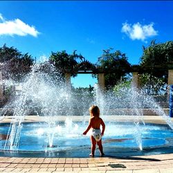 Full length of woman in water against clear sky