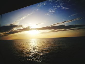 Scenic view of sea against sky at sunset