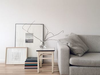 Sofa and table against wall at home