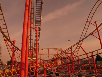 Low angle view of rollercoaster against sky