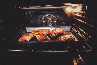 View of meat on barbecue grill