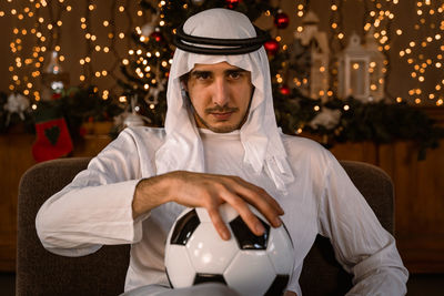 Portrait of man holding soccer ball