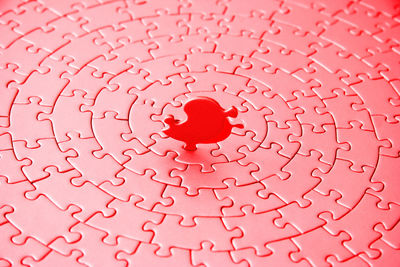 Full frame shot of red jigsaw puzzles