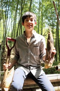 Portrait of a smiling young man sitting outdoors