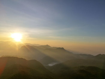 Scenic view of mountains against sky during sunset