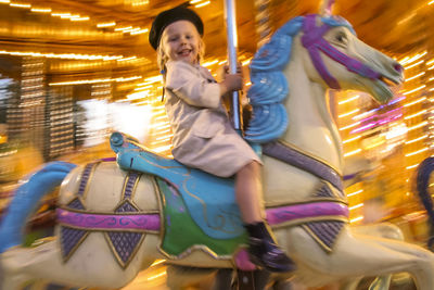 Statue of carousel in amusement park