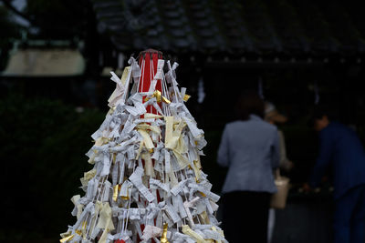 People outside temple against building