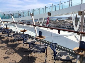 Ferris wheel in restaurant by sea against sky