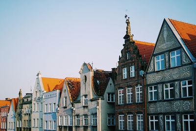 Low angle view of buildings against clear sky