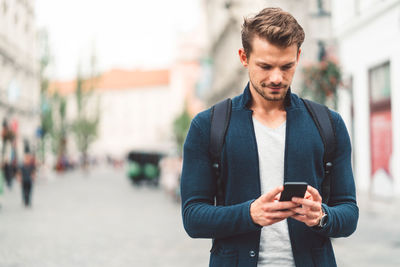 Young man using mobile phone